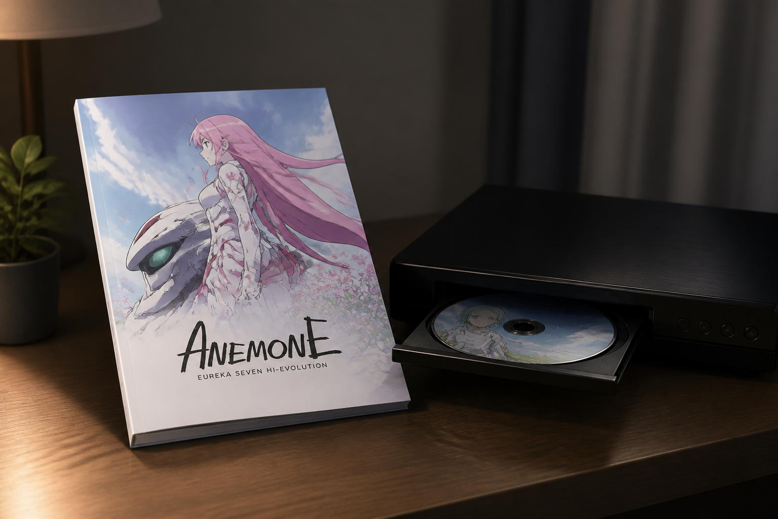 静かな部屋のデスク上に置かれたアニメ作品の公式パンフレットと映像プレイヤー